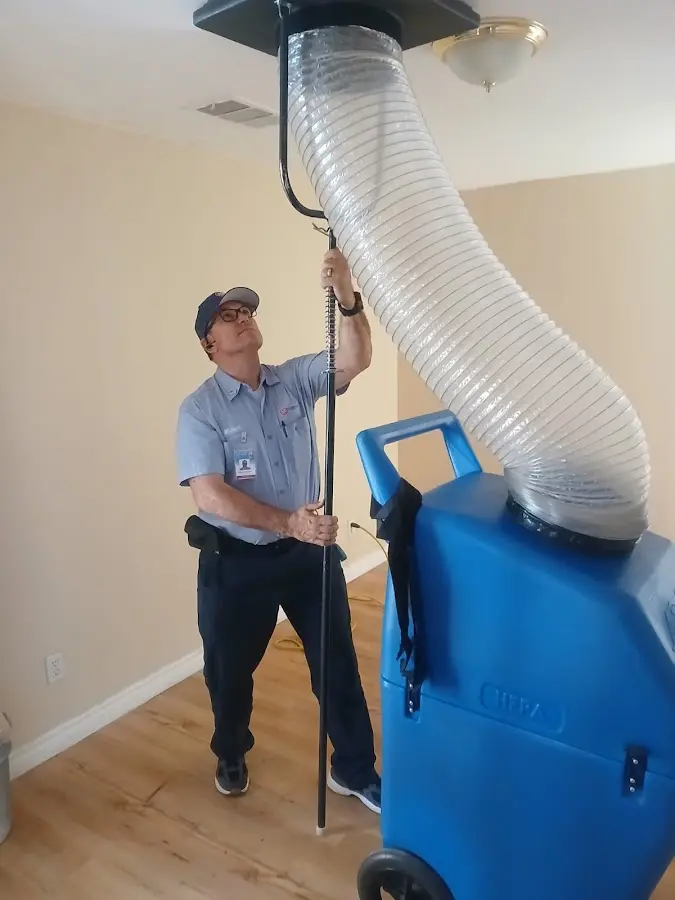 Furnace Tune-Up technician using HEPA equipment in Cedar City